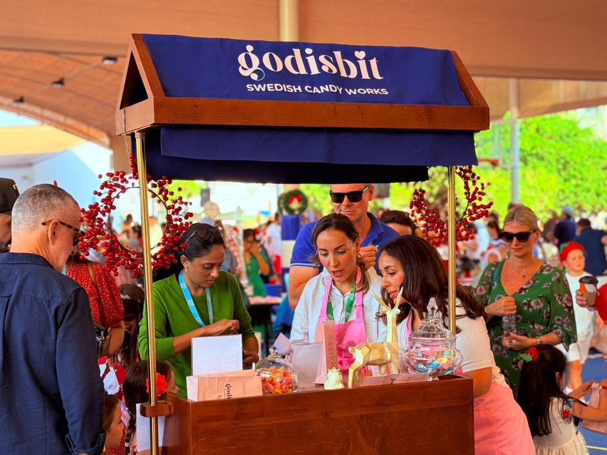 The Godisbit team serving candy at a public event